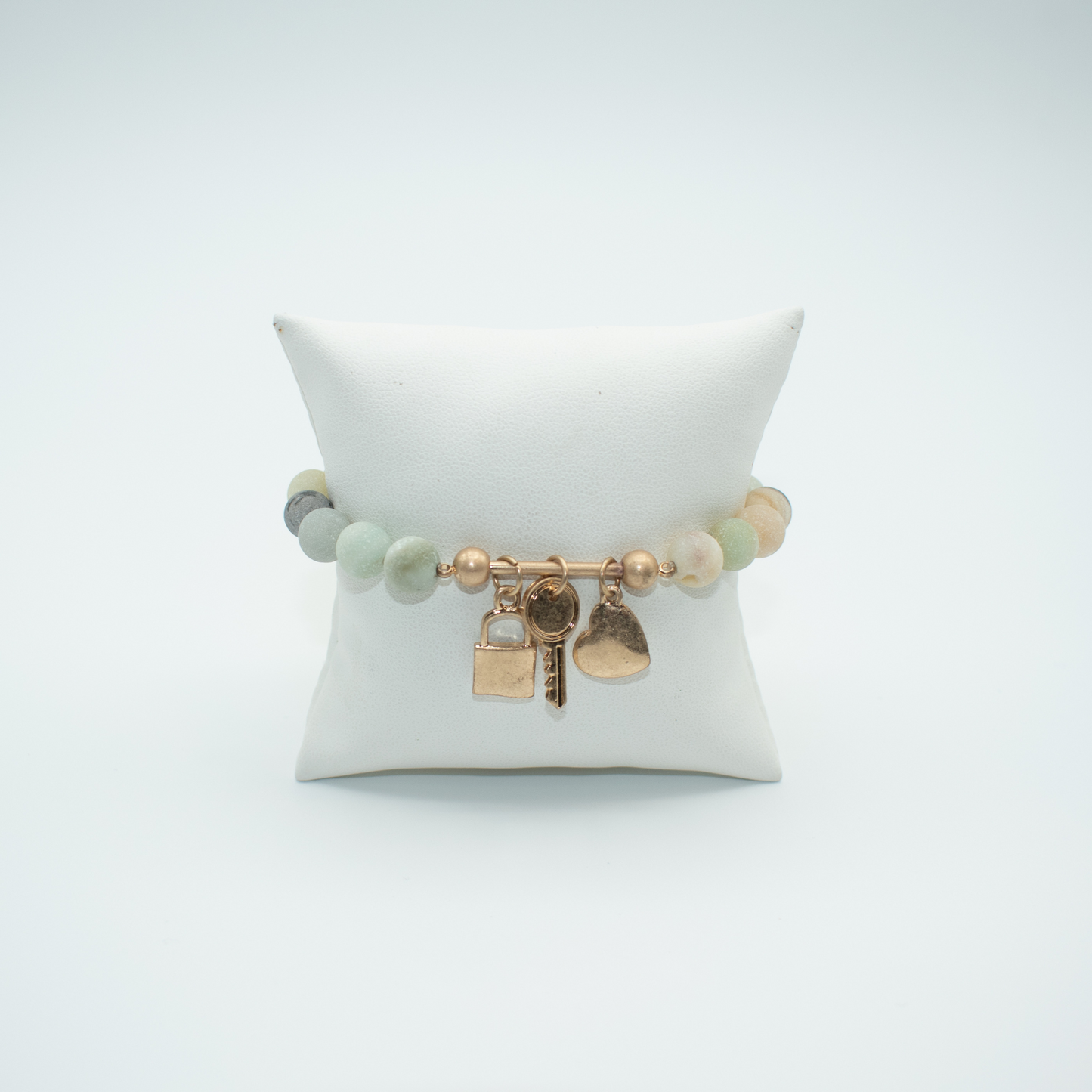 PRODUCT DETAIL Matte Amazonite Beads 3 Charms: Heart, Lock, Key Stretch Multicolor Approx. 6.5in to 7in 0.8oz Imported Lead Compliant Please measure your wrist before you make your purchase for an accurate fit. You will receive a free: Storage box or bag and cleaning cloth.