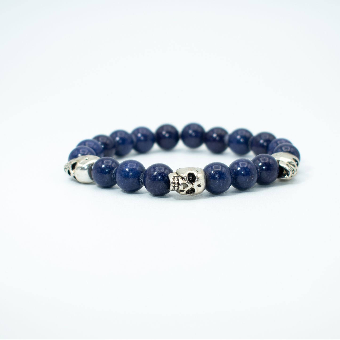 PRODUCT DETAILS 10mm Lapis Lazuli Beads Silver Finish Skulls Stretch 7.5 Inches 1.2 oz Handmade in USA We use premium durable materials and stones in our jewelry. All pieces may vary slightly in color, shape, and size. Please measure your wrist before you make your purchase for an accurate fit. Please leave a message if you need a different size. You will receive a free: Storage box or bag and cleaning cloth with your order.