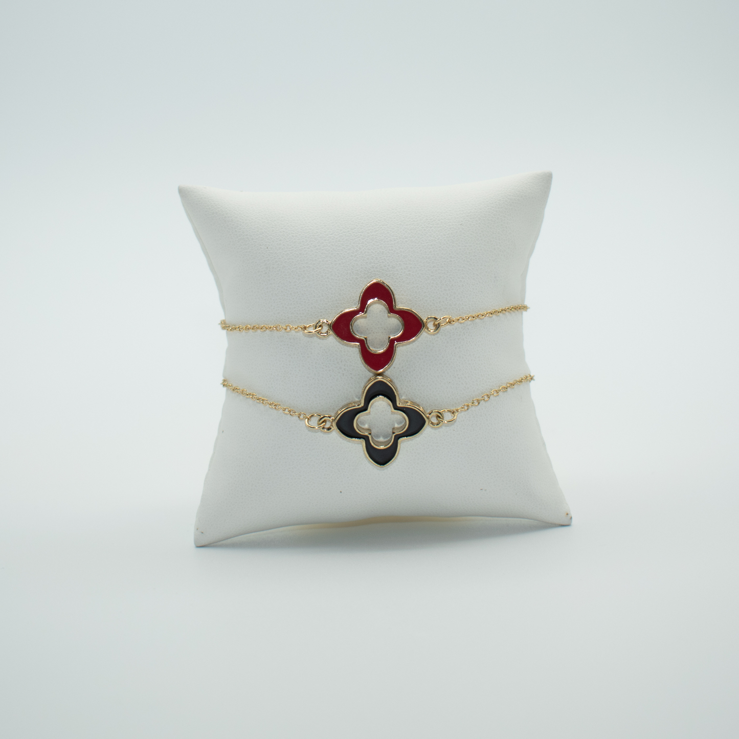 PRODUCT DETAIL Clover Charm Bracelet Lobster Clasp Closure Red and Gold Plated or Black and Gold Plated Approx. 7in. Extends to 9.5in 0.8oz Imported Lead Compliant Please measure your wrist before you make your purchase for an accurate fit. You will receive a free: Storage box or bag and cleaning cloth with 