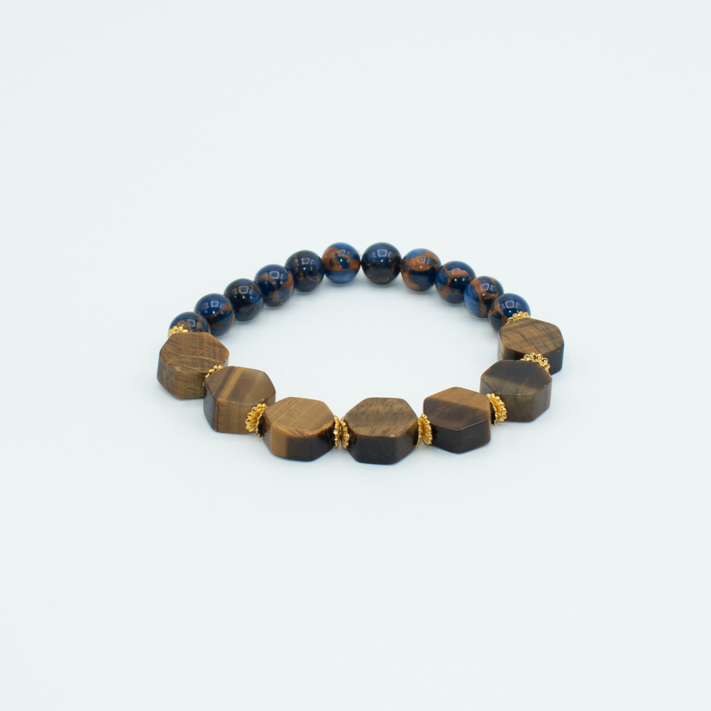 PRODUCT DETAILS 8mm Blue Sapphire Impression Jasper and Hexagon Tiger Eye Stretch 7.5 Inches 0.9oz Handmade in USA We use premium durable materials and stones in our jewelry. All pieces may vary slightly in color, shape, and size. Please measure your wrist before you make your purchase for an accurate fit. Please leave a message if you need a different size. You will receive a free: Storage box or bag and cleaning cloth with your order.