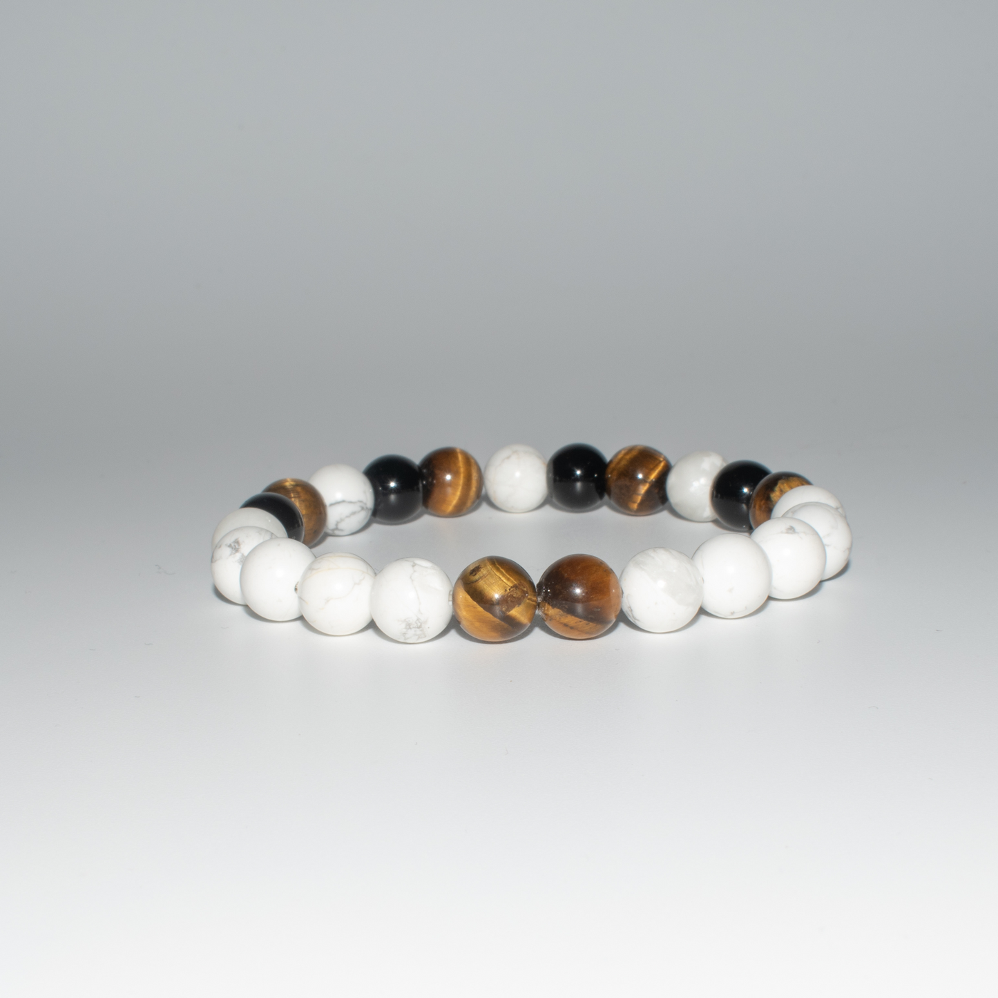 PRODUCT DETAILS  8mm&nbsp;Howlite and Tiger Eye Beads Brown/White Stretch&nbsp; 7.5 Inches 0.9oz Handmade in USA We use premium durable materials and stones in our jewelry. All pieces may vary slightly in color, shape, and size. Please measure your wrist before you make your purchase for an accurate fit. Please leave a message if you need a different size.  You will receive a free: Storage box or bag and cleaning cloth with your order.